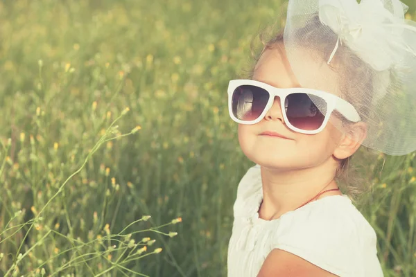 Happy little girl playing in park. — Stock Photo, Image