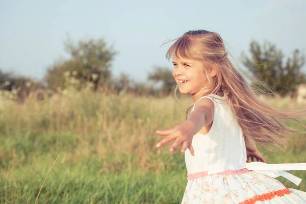 Happy little girl playing in park. — Stock Photo, Image