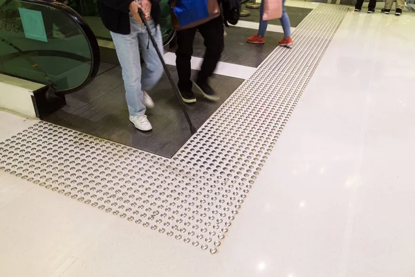Tactile paving path for the blind entrance exit of escalator — Stock Photo, Image