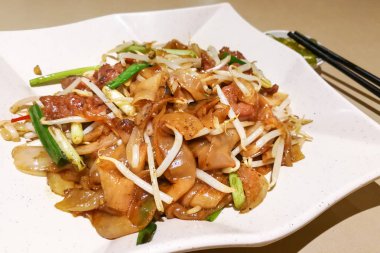 Fried Kuey Teow ile sığır eti, Malezya'da popüler