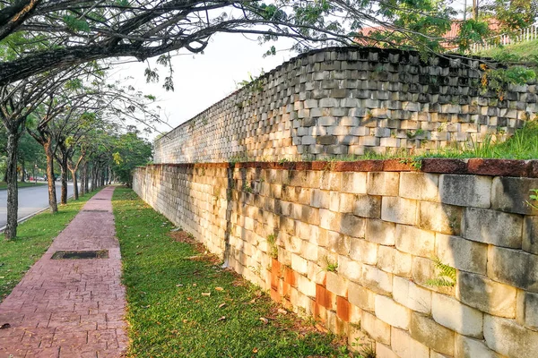 Interlocking designed retaining wall to manage earth erosion