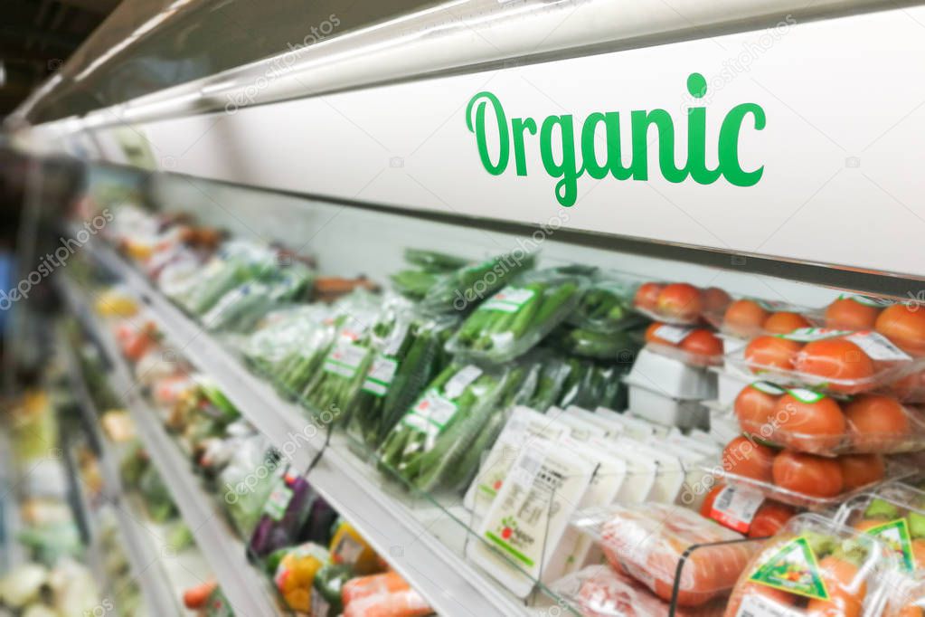 Organic food signage on modern supermarket fresh produce vegetab