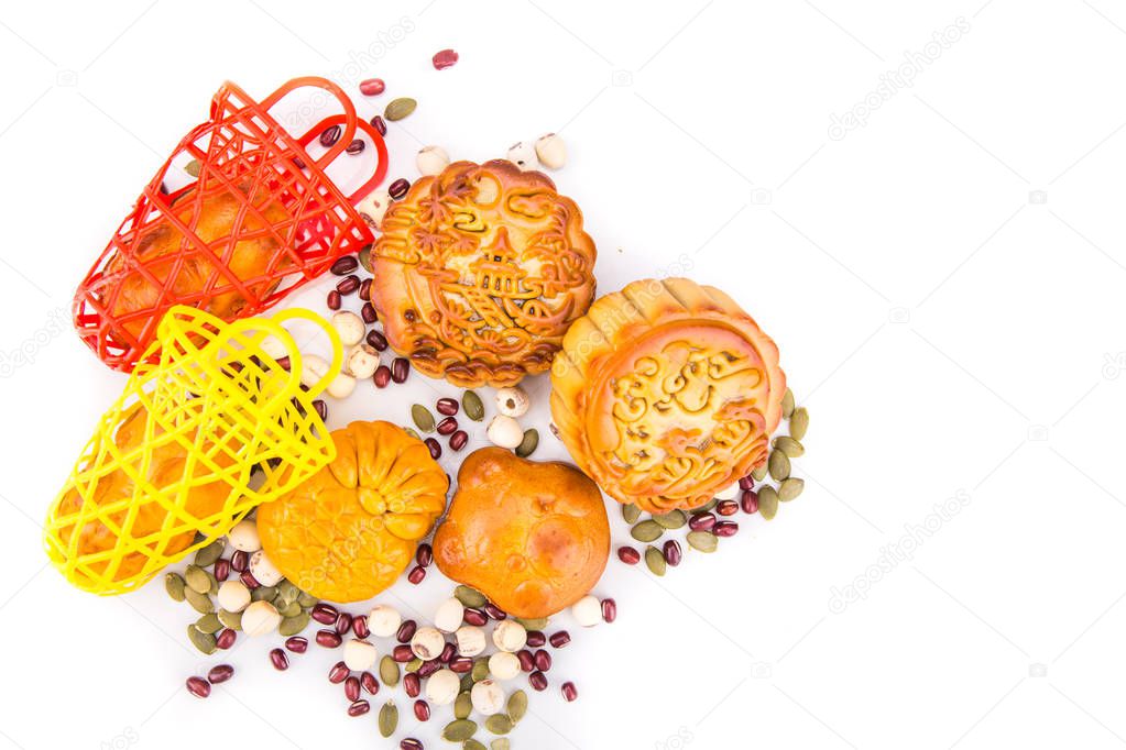 Mid Autumn festival Chinese moon cake  with ingredients on white background