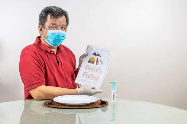 Conceptual Asian Man Face Mask Glove Sanitizer Looking Disposable Menu — Stock Photo, Image