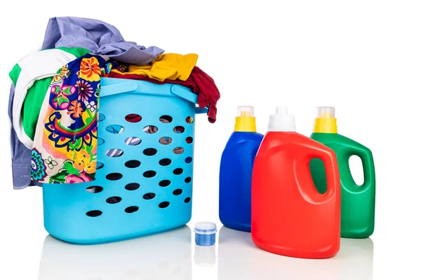 Regular liquid laundry detergent of various fragrance variant with basket full of clothes against white background