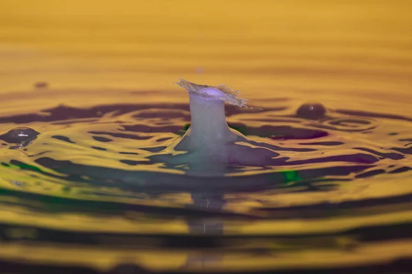 A drop of water clash with another — Stock Photo, Image