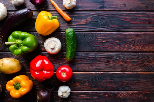 Fresh vegetables on a wooden background and space for text — Stock Photo, Image