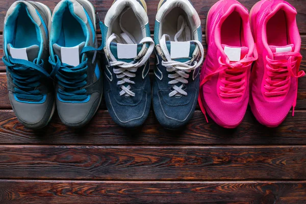 Sneakers on a wooden background and space for text — Stock Photo, Image