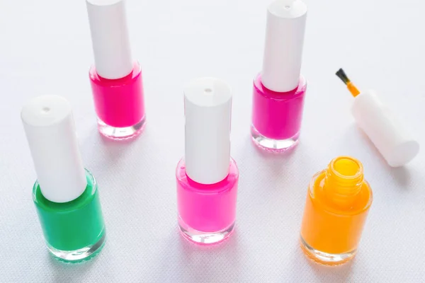 Multi-colored nail polish on a white background — Stock Photo, Image