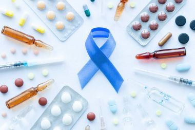 blue ribbon symbol of prostate cancer, syringes and pills clipart