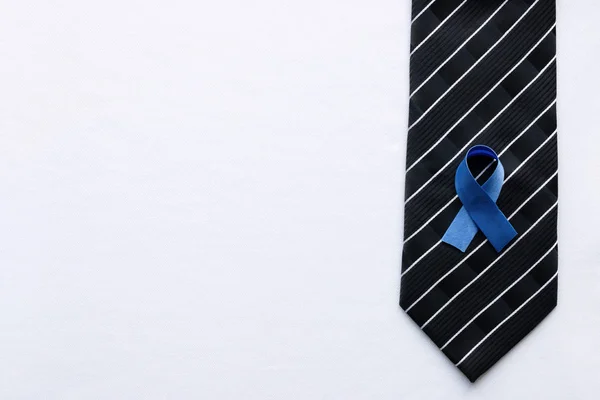 Blue ribbon to tie as a symbol of prostate cancer — Stock Photo, Image