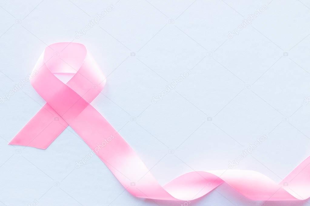 pink ribbon breast cancer symbol on white background