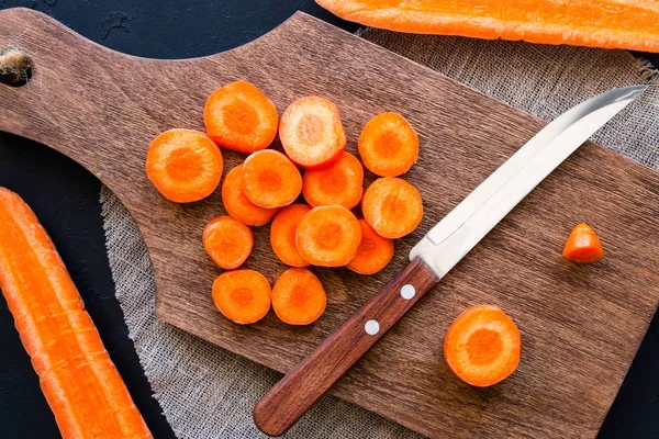 Sliced carrots on a cutting board — Stock Photo, Image