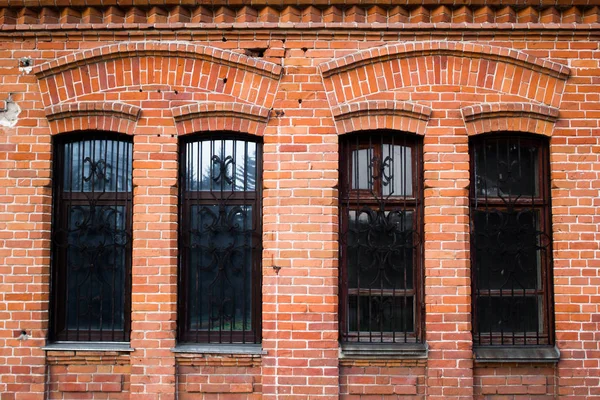 Red brick wall with Windows