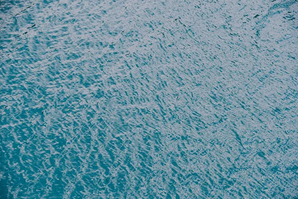 Smooth surface of lake with blue water, turquoise sea as background