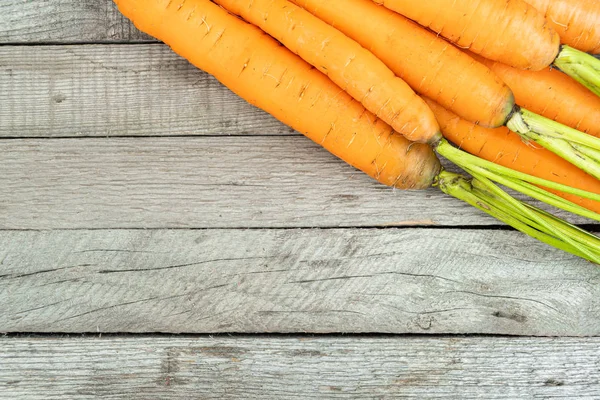 fresh carrots on wooden table, cooking vegetarian dishes, growing vegetables farm