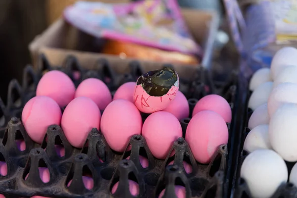 Pink eggs  sold in market in Luang Prabang.