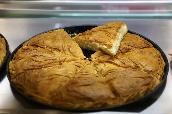 Traditional greek Cheese pie in shop for sale