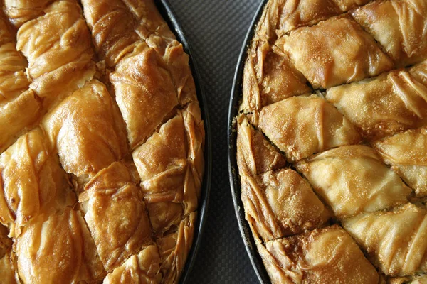 Traditional greek Cheese pie and spinach pie in pan shot from above