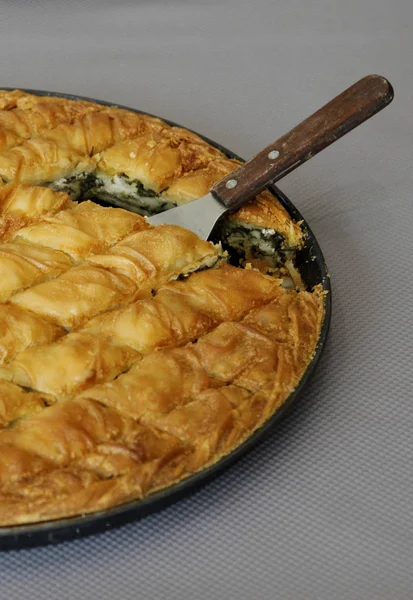 Traditional greek Cheese pie in pan shot from above