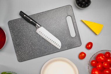 Ingredients for making salad on the kitchen table. The chef cooks the food.