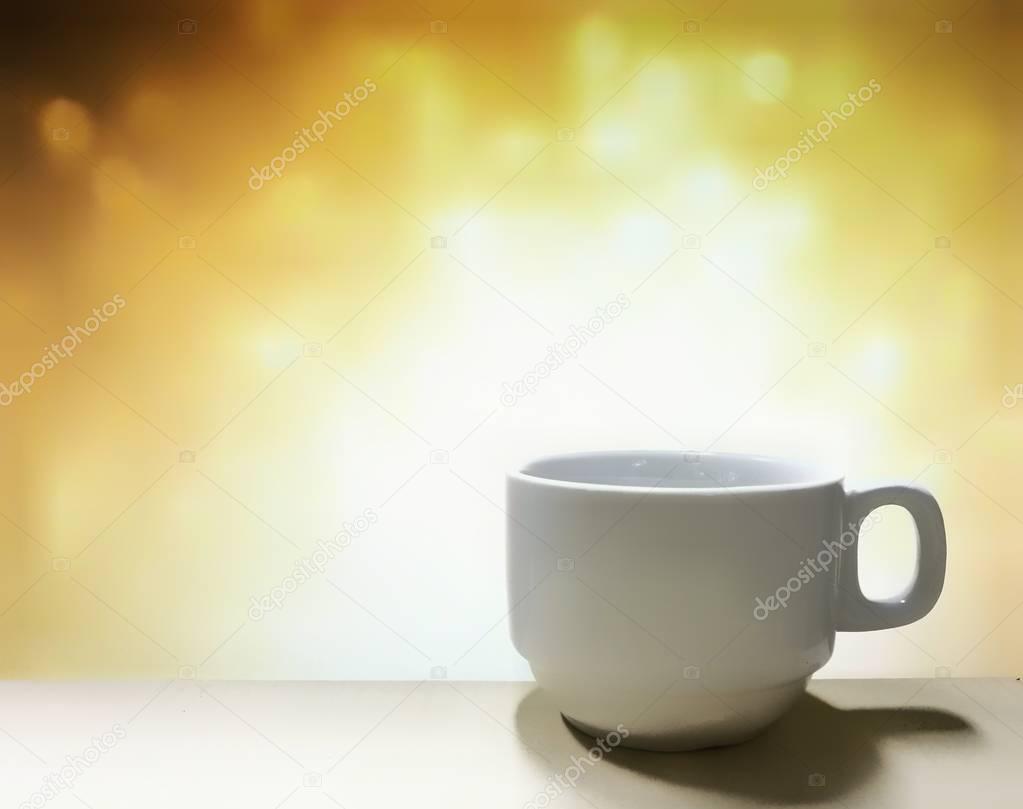 coffee cup with bokeh soft defocused background. energy motivation concept