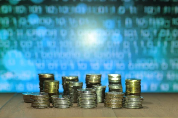Digital economy coin stack with binary computer code in the background