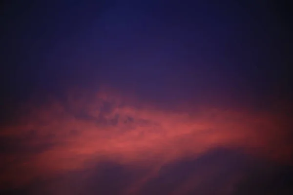 blue purple sky and red clouds. twilight hour golden time for photography. calming and serenity scene in early night. hope and dream romantic moment.