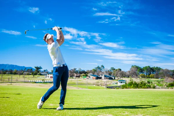 Golfer playing a shot on the fairway — Stock Photo, Image