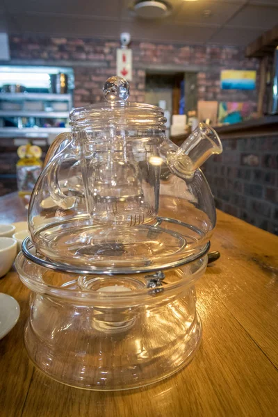 Glass tea pot on a table in a cafe — Stock Photo, Image