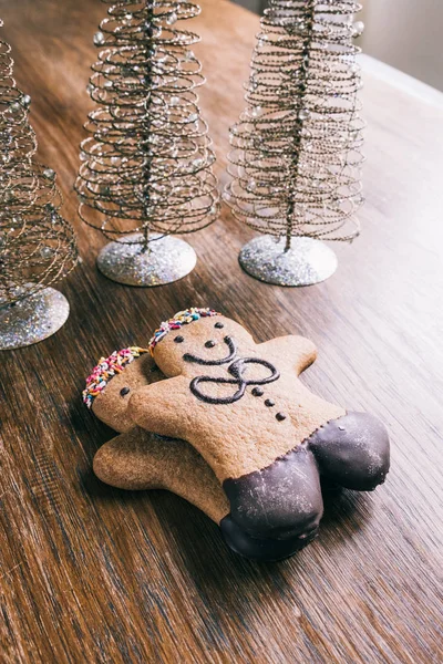 Ginger bread man on a wooden table — Stock Photo, Image