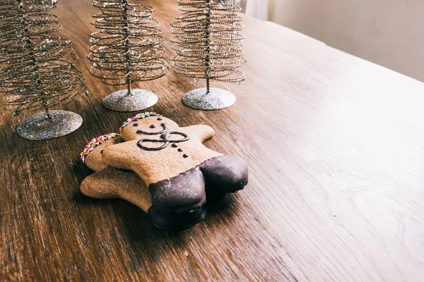 Ginger bread man on a wooden table — Stock Photo, Image