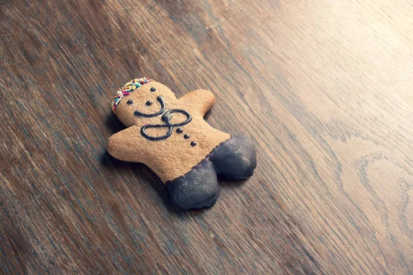 Ginger bread man on a wooden table — Stock Photo, Image