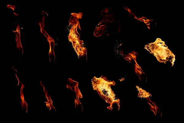 Set of isolated flames on a black background — Stock Photo, Image