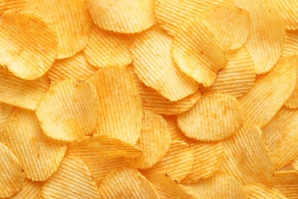 Achtergrond golvende gouden chips met textuur — Stockfoto