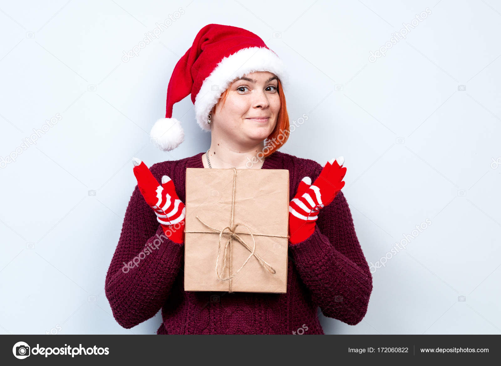 Spirit Of Christmas And New Year Concept Of A Holiday And Days Off A Cool Girl In A Santa Claus Hat Very Beautiful Portrait Of A Woman With A Gift Spirit Of Christmas And New Year Concept Of A Holiday And Days Off A Cool Girl In A Santa Claus Hat Very Beautiful Portrait Of A Woman With A Gift