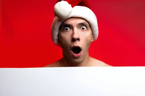 Christmas New Year concept, Stylish guy santa hat very surprised — Stock Photo, Image