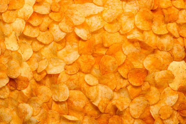 Chips texture crisp potato background of golden unhealthy food p — Stock Photo, Image