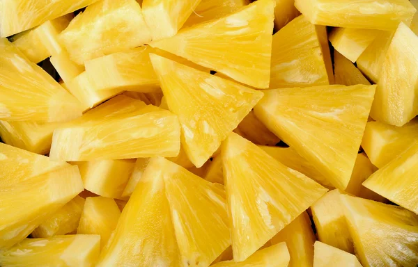 Dilim ananas arka plan dokusu kadar kapatın — Stok fotoğraf