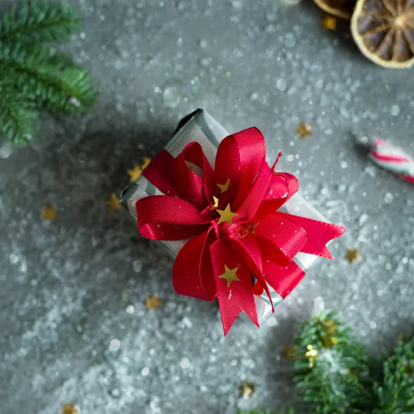 Christmas Present Red Ribbon Golden Stars Fir Candy Snowflakes Grey Лицензионные Стоковые Фото