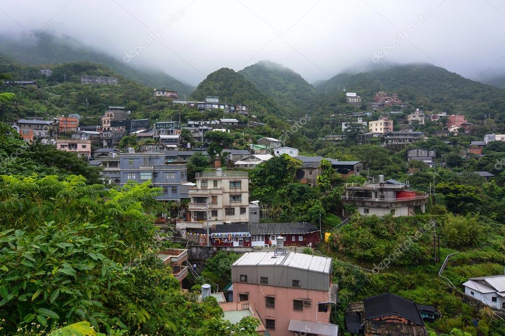 Houses in a small hillside village in the misty mountains of Jiufen, Taiwan