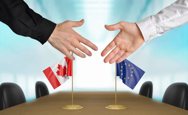 Anlaşma, aynı fikirde olmak el sıkışan Kanada ve Avrupa Birliği diplomatların bölüm 3d render — Stok fotoğraf