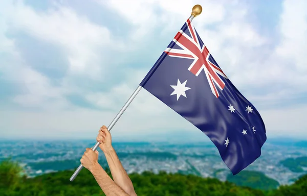 Young man's hands proudly waving the Australia national flag in the sky, part 3D rendering — Stock Photo, Image