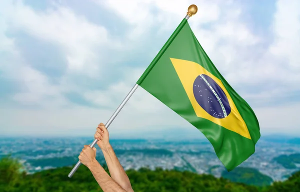 Mãos do jovem orgulhosamente acenando a bandeira nacional do Brasil no céu, parte 3D renderização — Fotografia de Stock