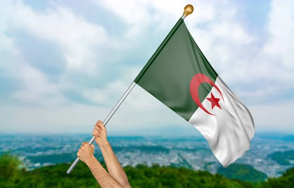 Manos de hombre joven orgullosamente ondeando la bandera nacional de Argelia en el cielo, parte 3D representación —  Fotos de Stock