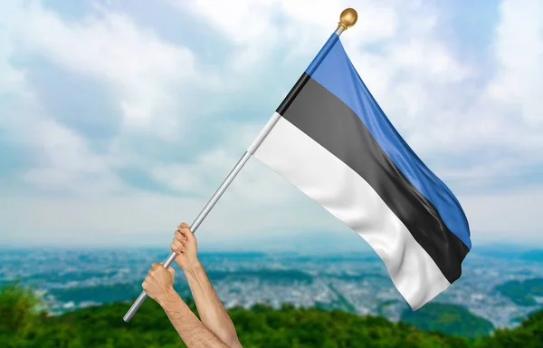 Ung mans händer stolt vajande Estland flagga i himlen, del 3d-rendering — Stockfoto