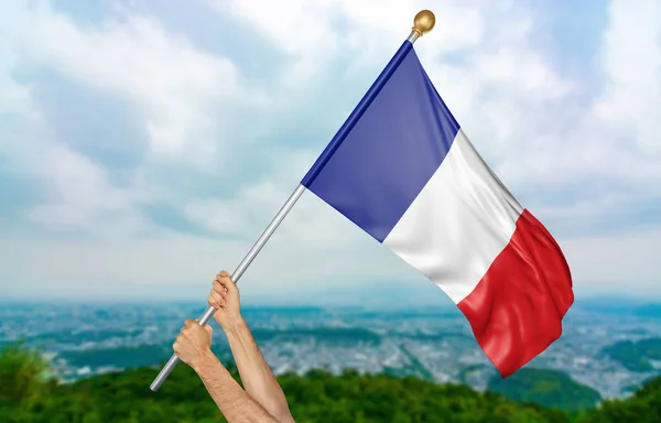 Young man\'s hands proudly waving the France national flag in the sky, part 3D rendering