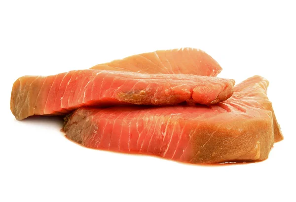 Two uncooked, raw tuna fish steaks isolated on a white background — Stock Photo, Image