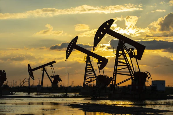 in the evening, oil pumps are running