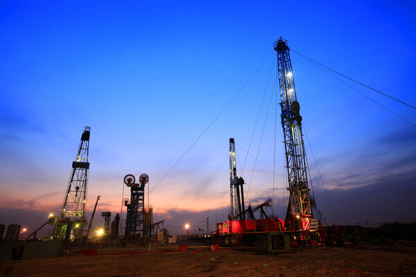 In the evening of oilfield derrick
